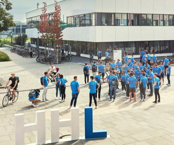 many students at HHL campus in Blue shirts with big HHL letters