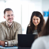 Full-time Master students smiling.